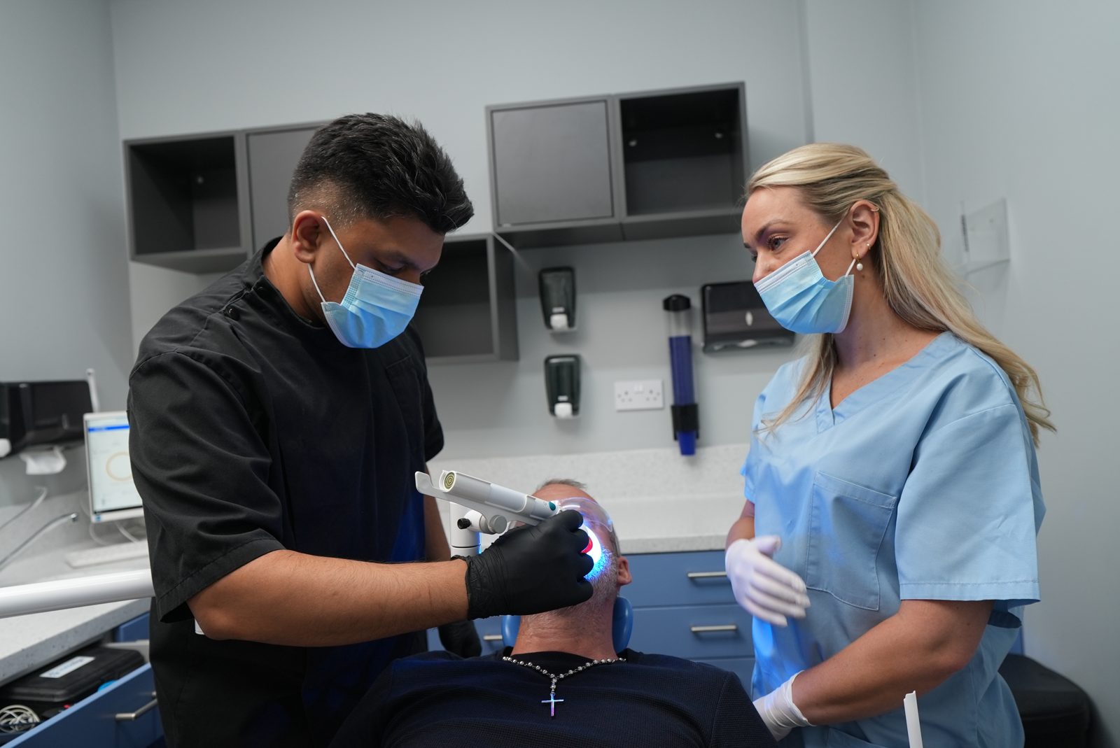 Dentist and dental nurse caring for a patient at Welling Dental Studio